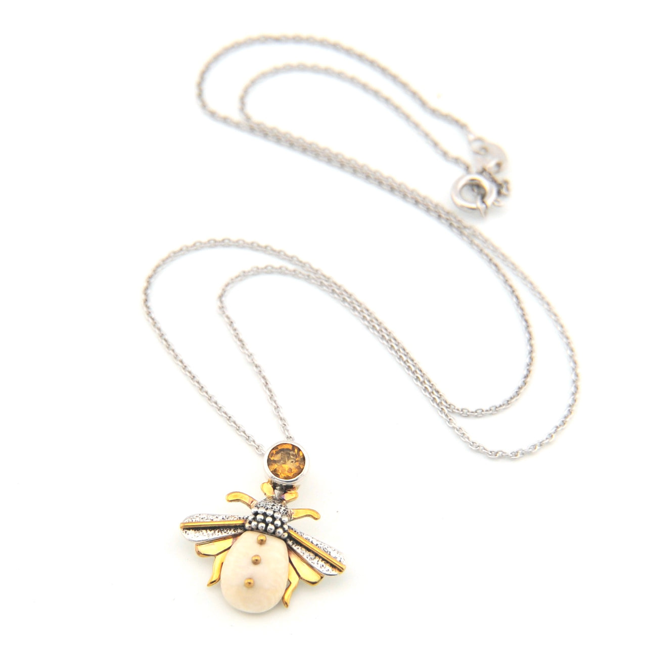 Necklace with a bee-shaped pendant on a white background
