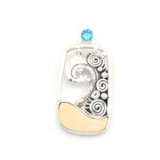 Silver wave pendant with a blue gemstone on a white background