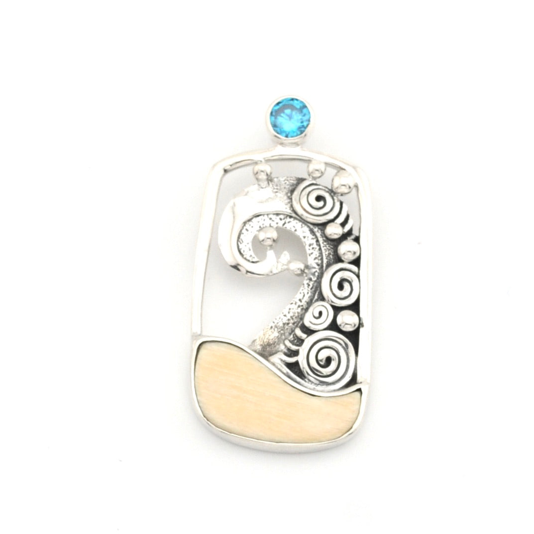 Silver wave pendant with a blue gemstone on a white background