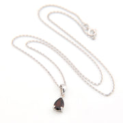 Necklace with a teardrop-shaped pendant on a white background
