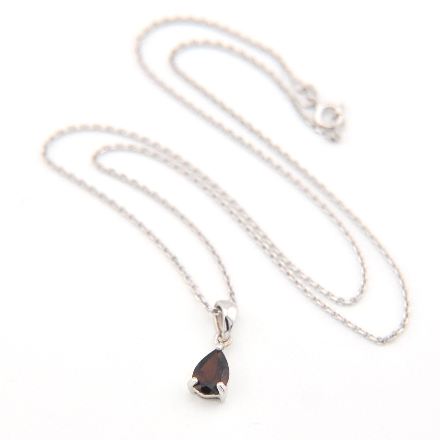 Necklace with a teardrop-shaped pendant on a white background