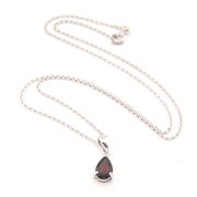 Necklace with a teardrop-shaped pendant on a white background