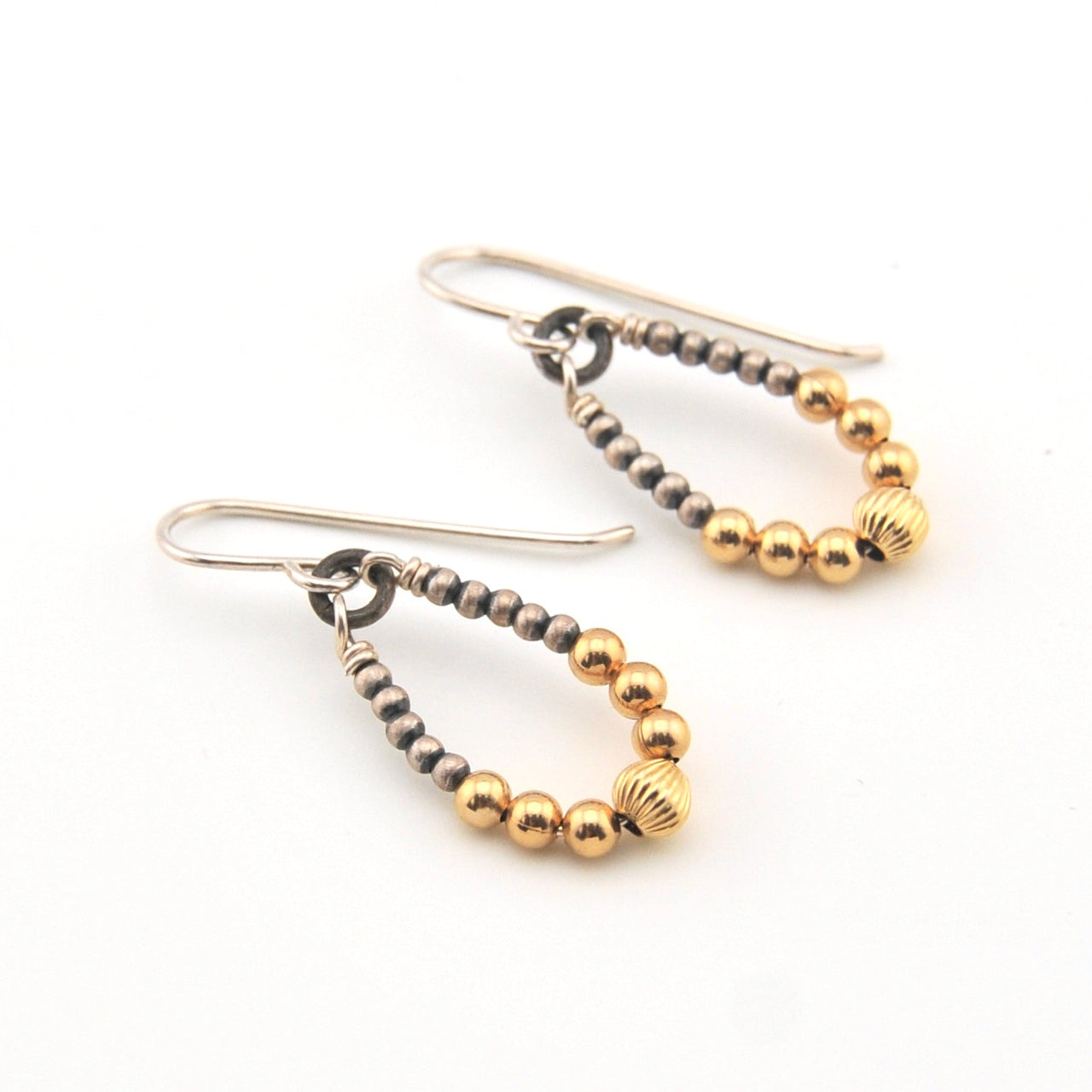 Pair of beaded earrings on a white background