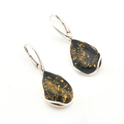Teardrop-shaped earrings with black and gold speckled stones on a white background