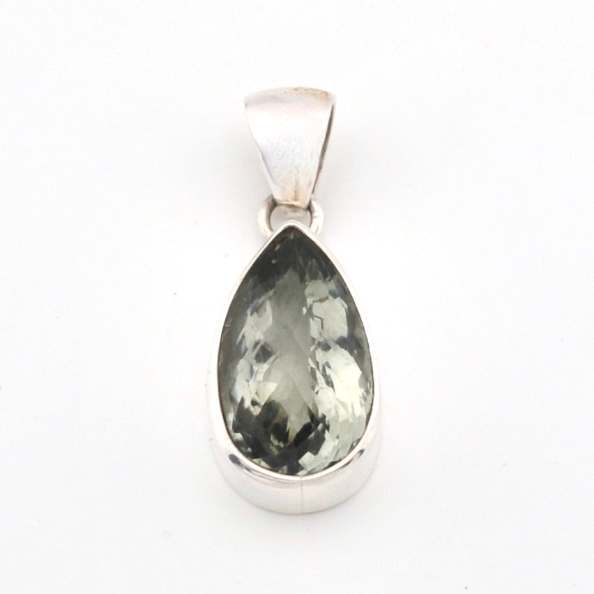 Teardrop-shaped green gemstone pendant on a white background