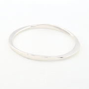 Silver bangle on a white background