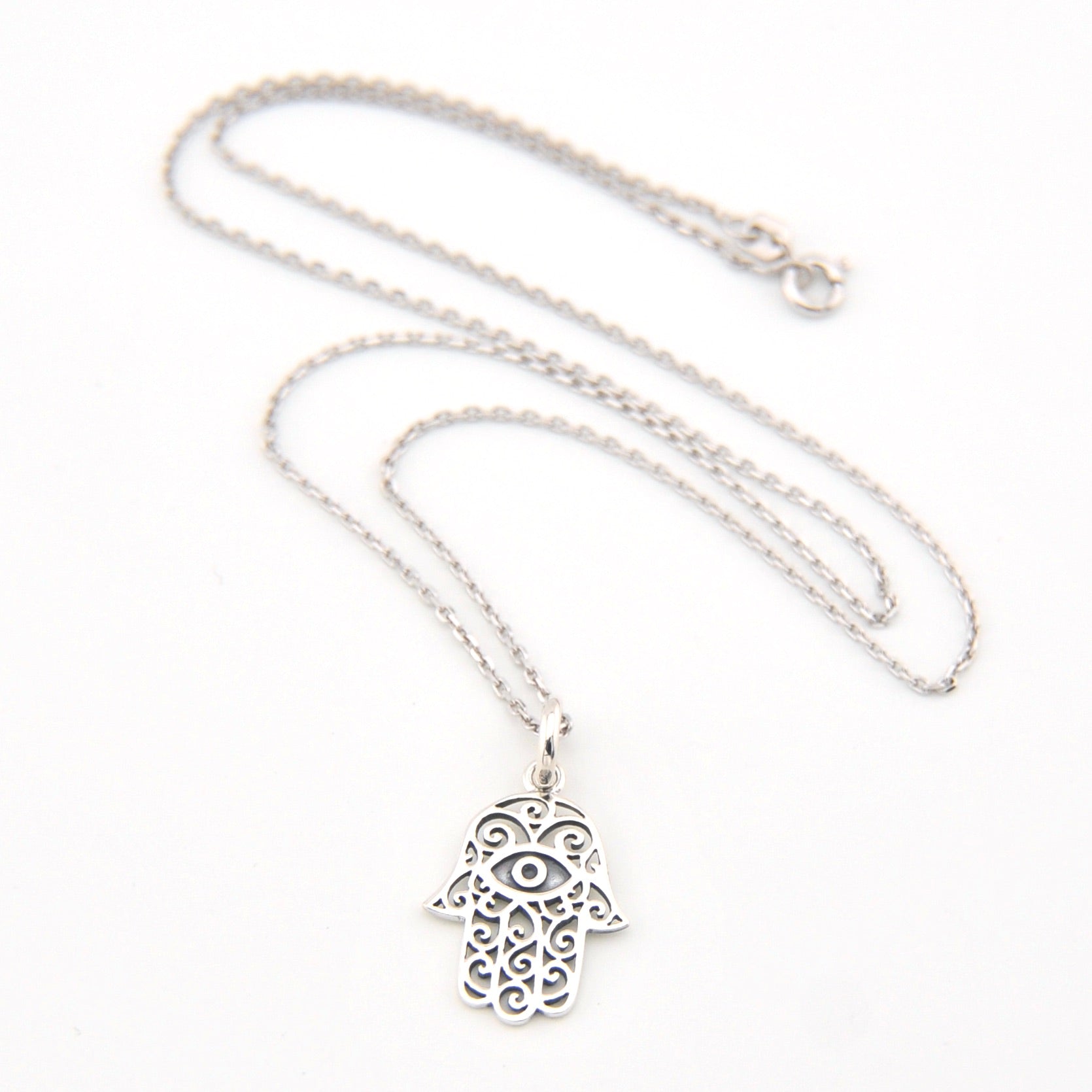Silver Hamsa hand necklace on a white background