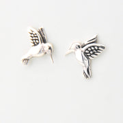 Silver hummingbird earrings on a white background