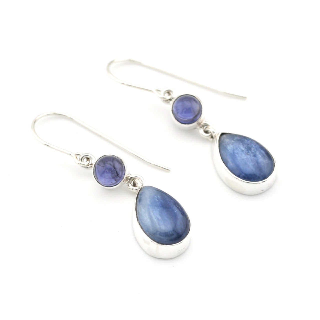 Pair of silver earrings with blue teardrop-shaped stones on a white background