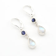 Silver earrings with teardrop-shaped gemstones on a white background