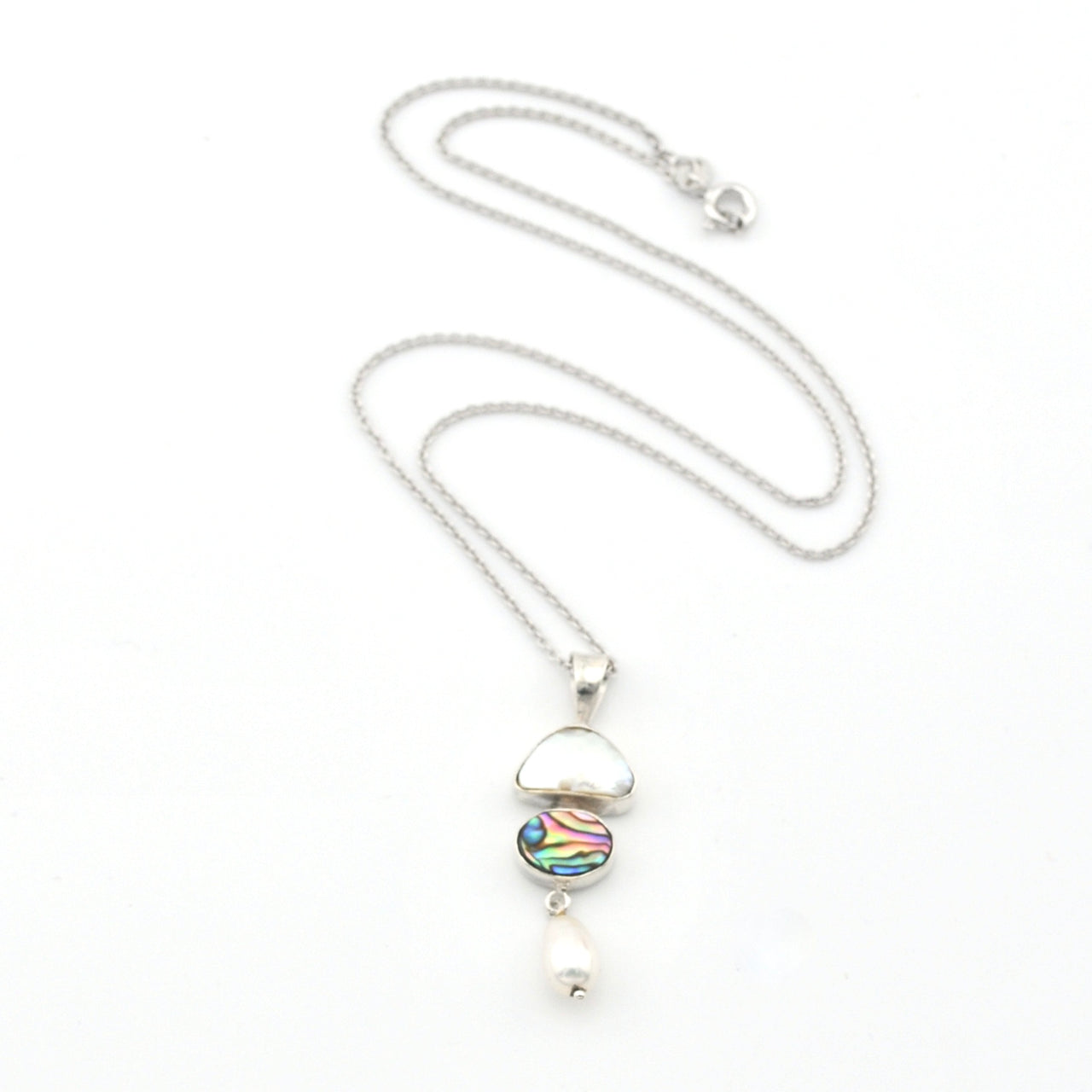 Silver necklace with a colorful pendant on a white background