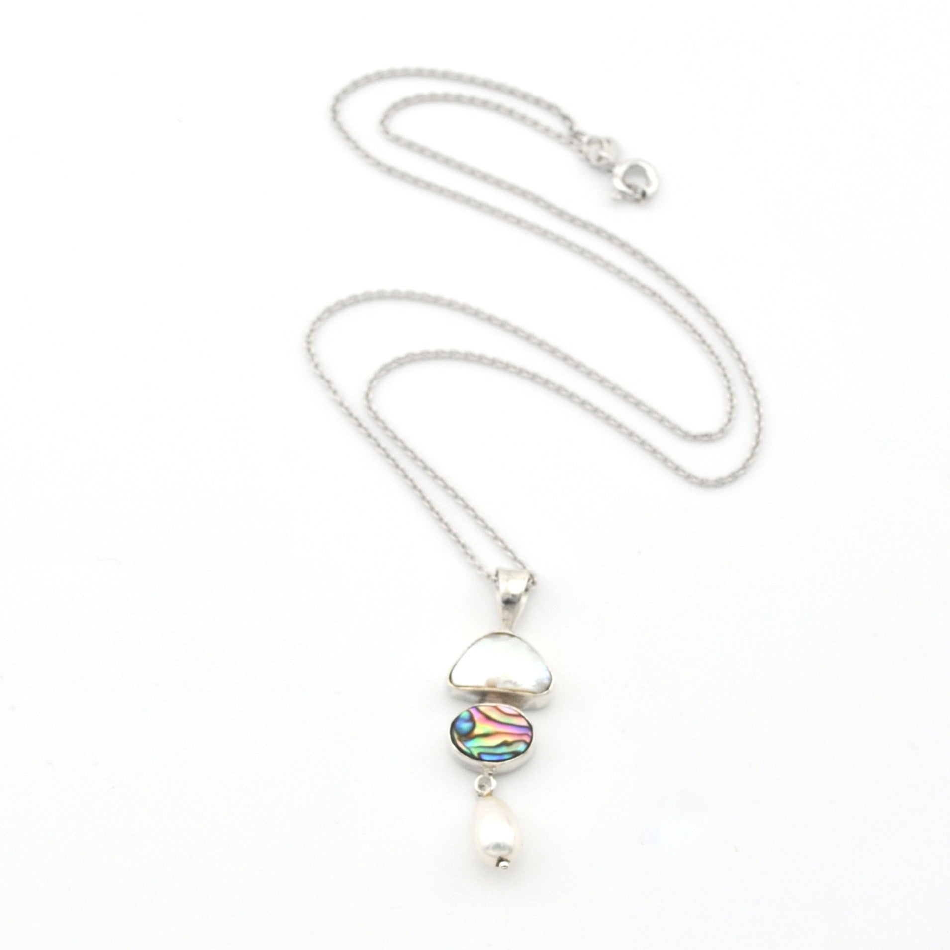Silver necklace with a colorful pendant on a white background