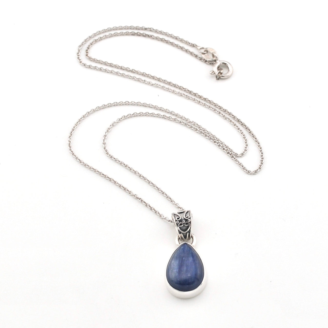 Necklace with a blue kyanite teardrop pendant on a white background