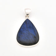 Teardrop-shaped blue pendant on a white background