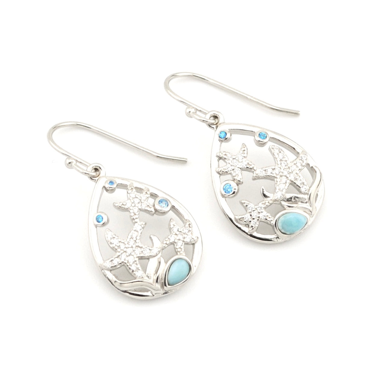 Silver earrings with starfish design on a white background