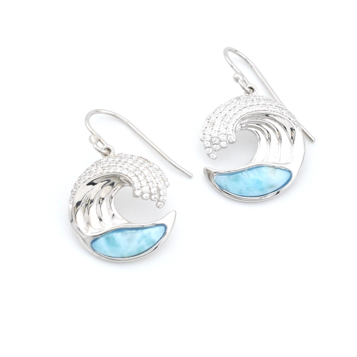 Silver earrings with blue wave design on a white background