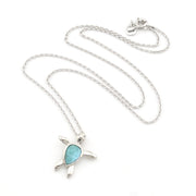 Silver necklace with a turtle pendant featuring a blue stone on a white background