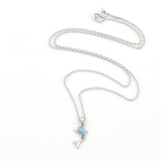 Silver necklace with a blue pendant on a white background