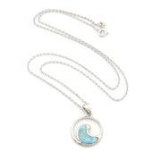Necklace with a circular pendant featuring a blue wave design on a white background