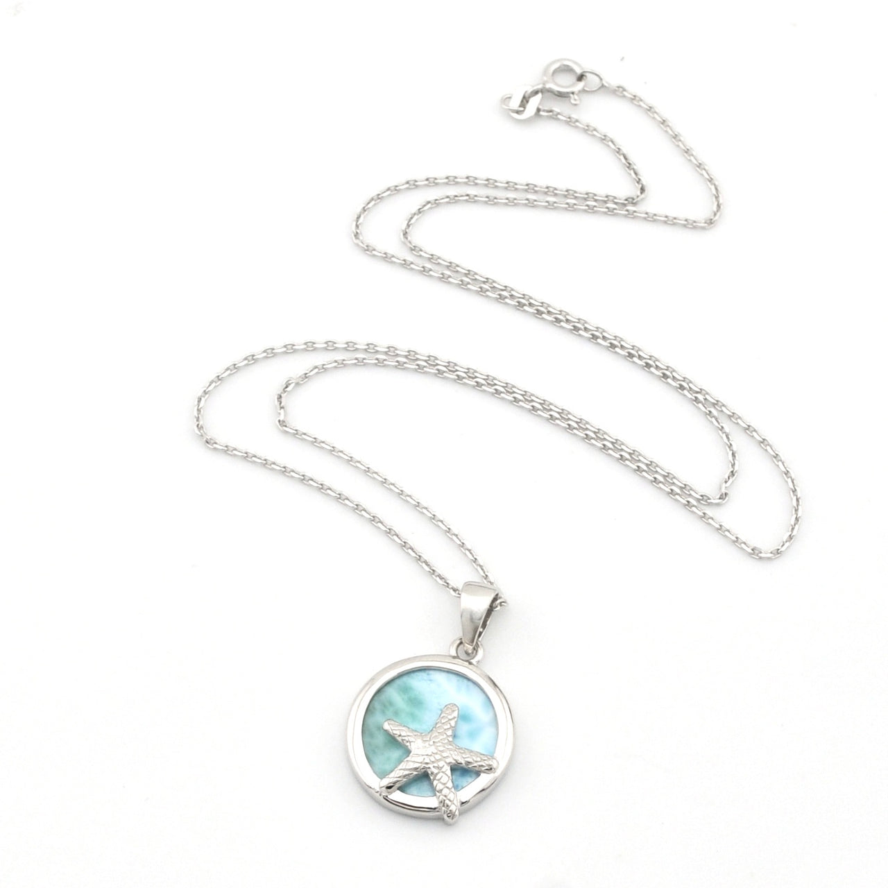 Silver necklace with a starfish pendant on a white background