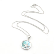 Silver necklace with a starfish pendant on a white background