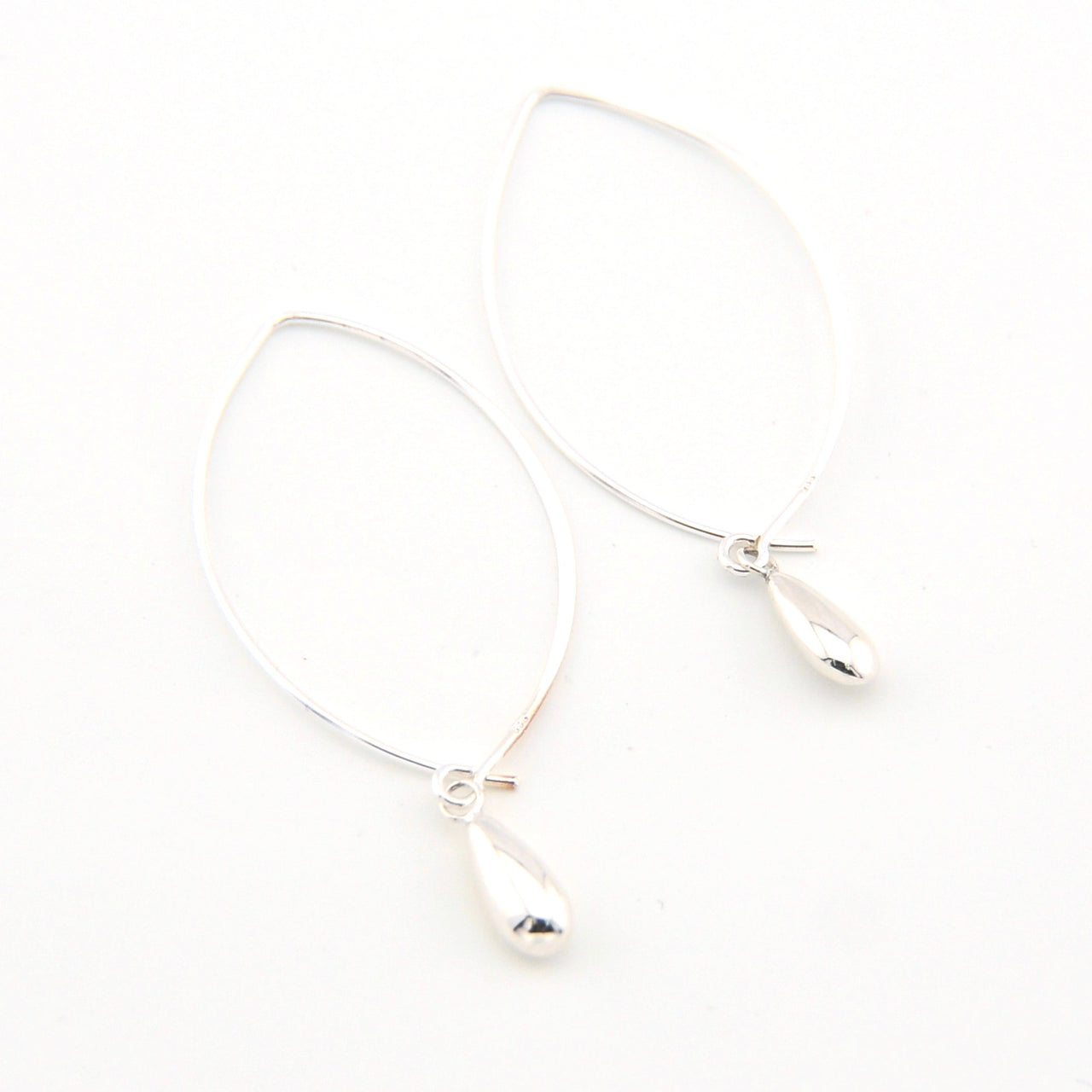 Silver earrings on a white background