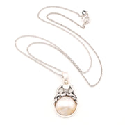 Silver pearl pendant with octopus on white background