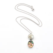 Necklace with a pendant featuring a multicolored stone on a white background