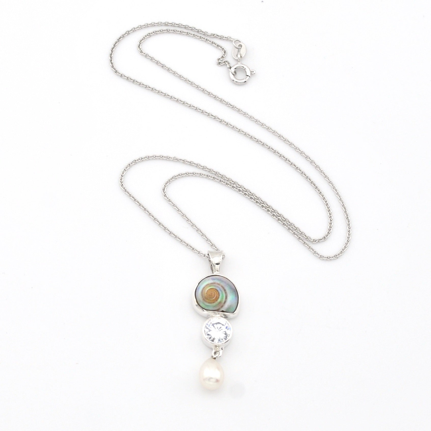 Necklace with pendant featuring a pearl and gemstone on a white background