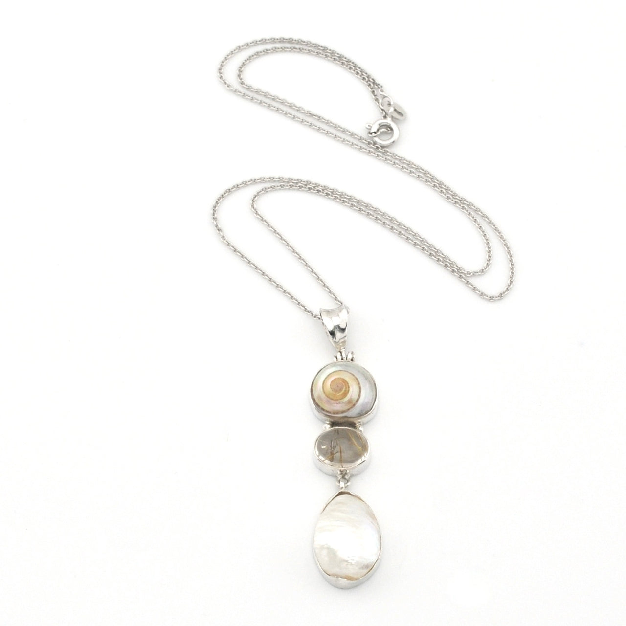 Necklace with a pendant featuring natural stones on a white background