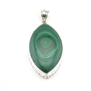 Green malachite pendant with silver setting on a white background