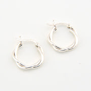 Silver hoop earrings on a white background