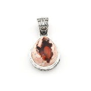 Silver pendant with a teardrop-shaped stone on a white background