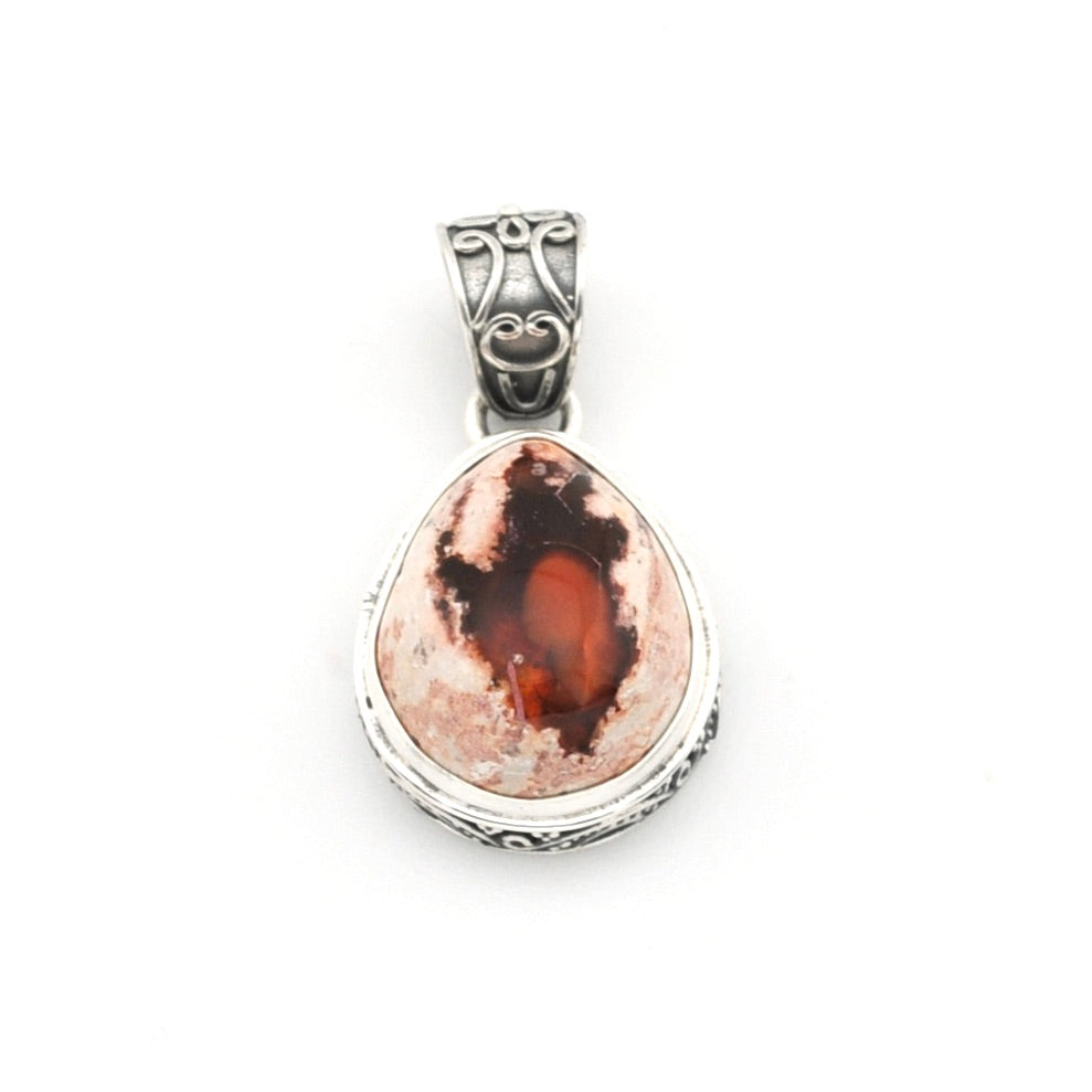 Silver pendant with a teardrop-shaped stone on a white background