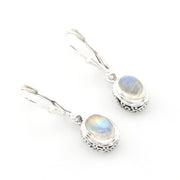 Silver earrings with rainbow moonstone stones on a white background