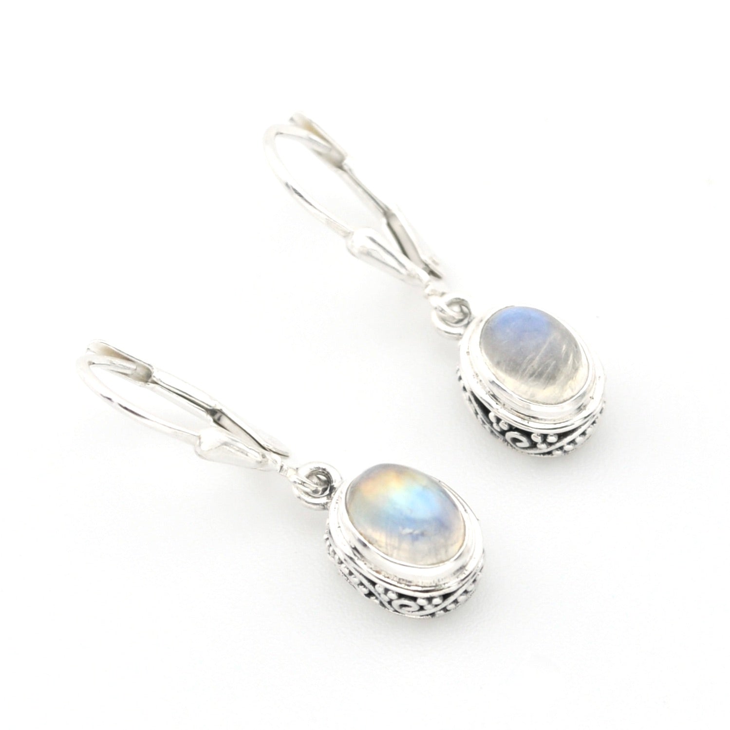 Silver earrings with rainbow moonstone stones on a white background