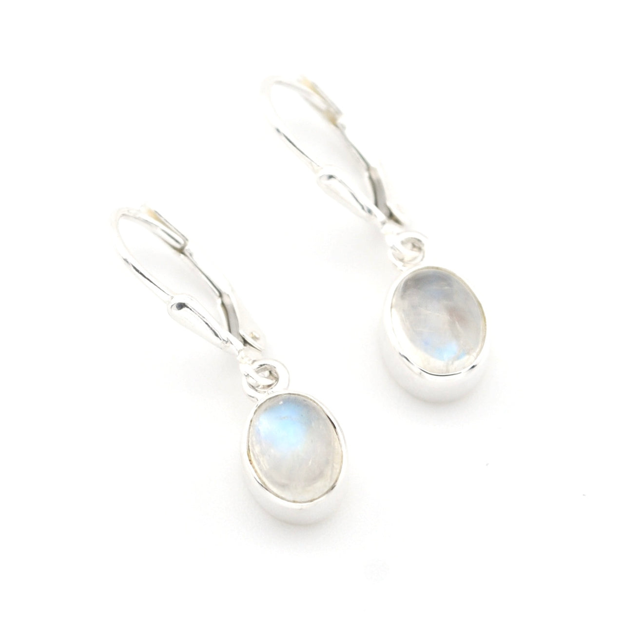 Silver earrings with moonstone drops on a white background