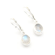 Silver earrings with moonstone drops on a white background