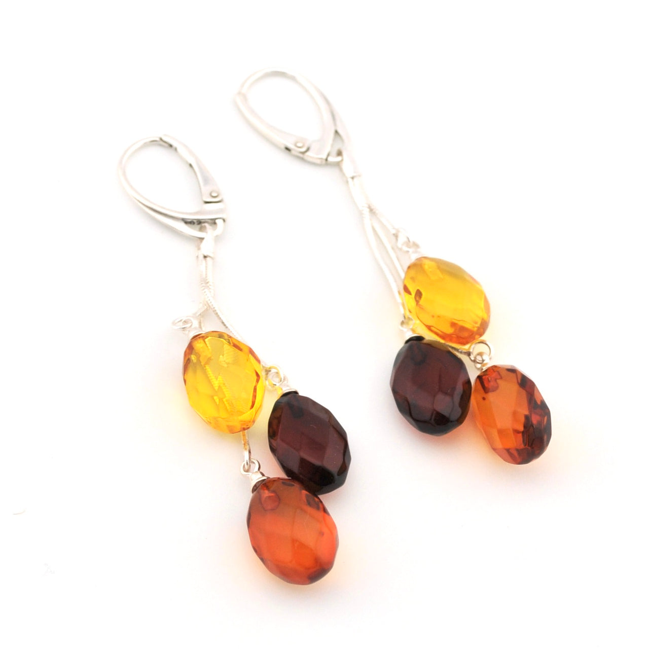 Pair of amber bead earrings on a white background