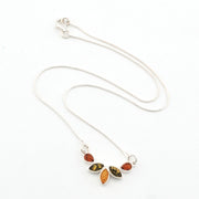Necklace with leaf-shaped pendant featuring multicolored stones on a white background
