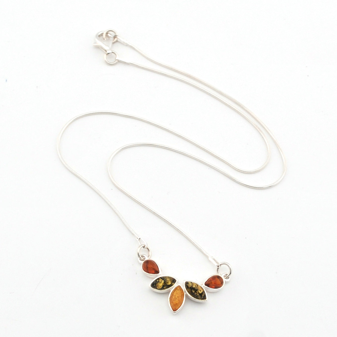 Necklace with leaf-shaped pendant featuring multicolored stones on a white background