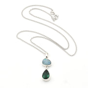 Necklace with two teardrop-shaped gemstones on a white background