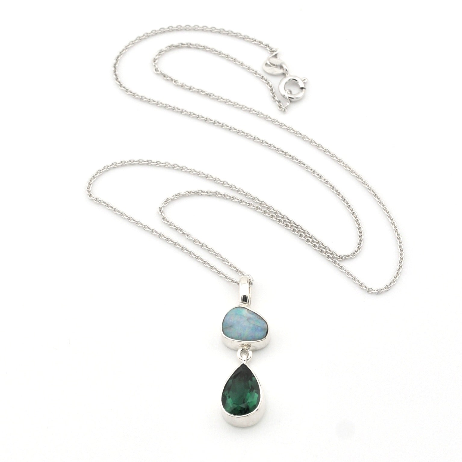 Necklace with two teardrop-shaped gemstones on a white background