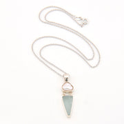 Necklace with a triangular pendant on a white background