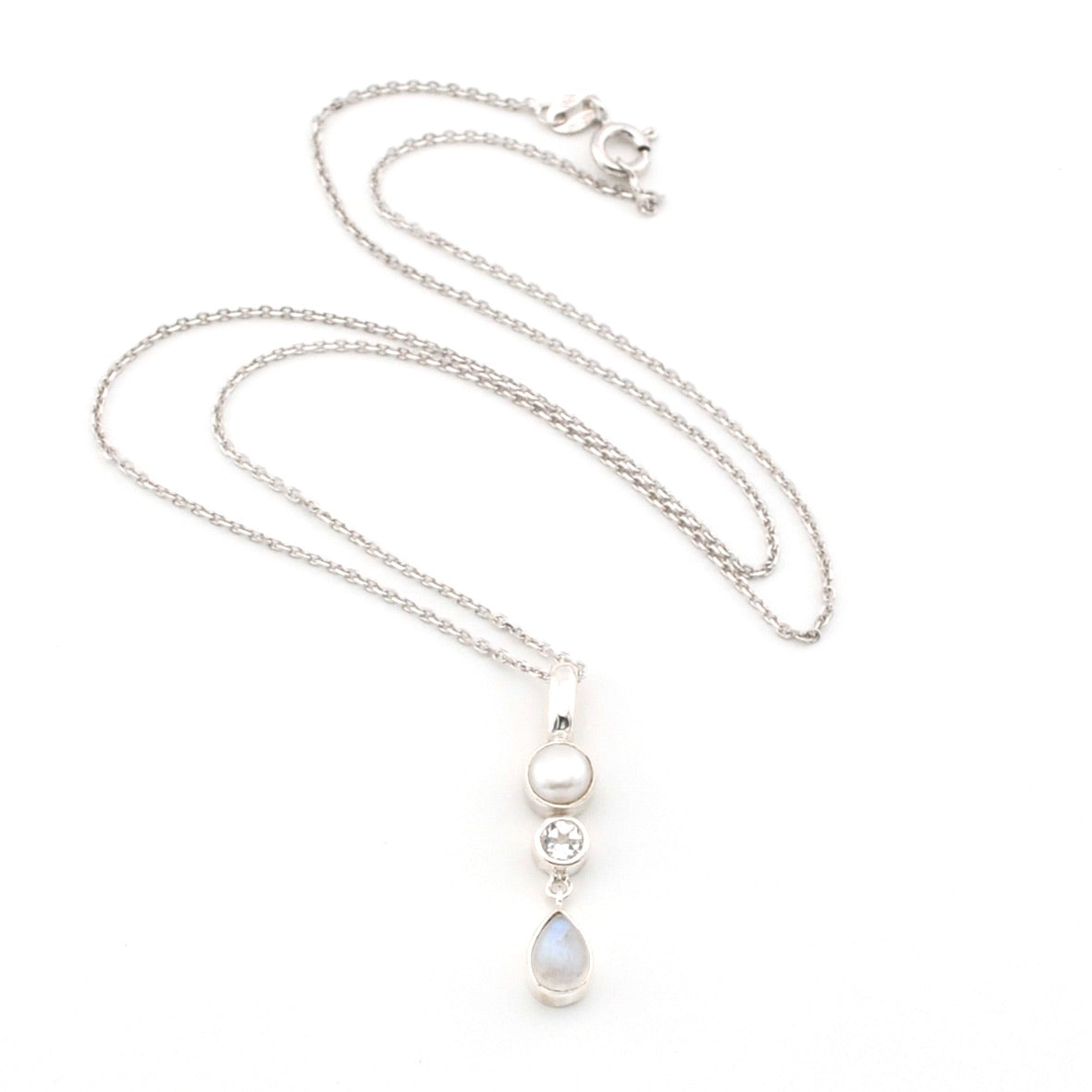 Silver necklace with a pendant on a white background