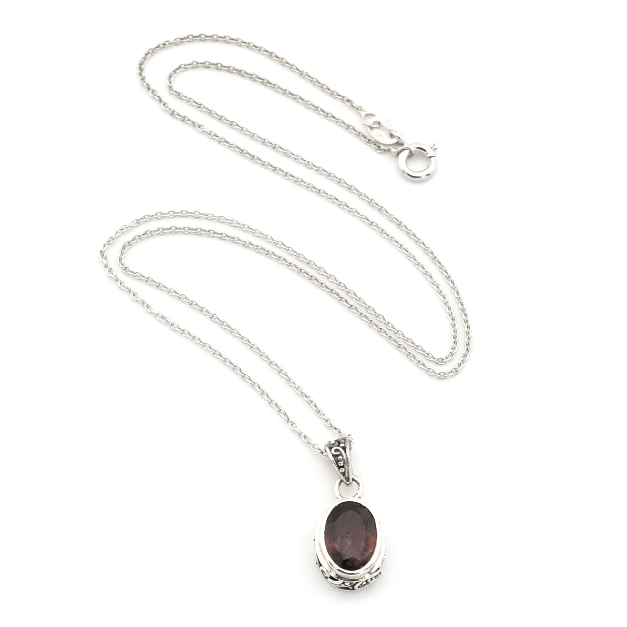 A silver chain necklace with an oval dark reddish-brown gemstone pendant, displayed on a clean white background.