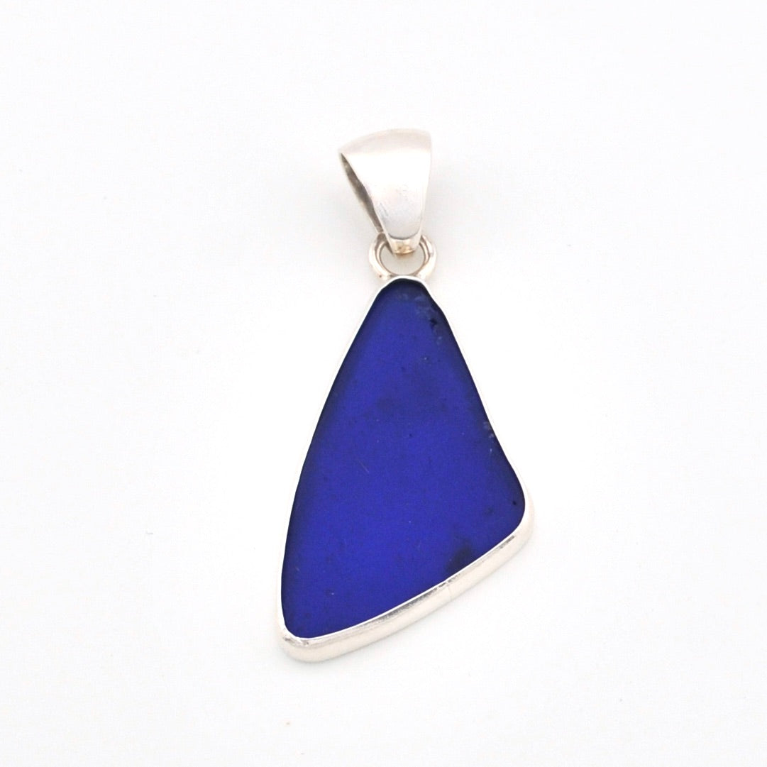 Blue pendant with silver chain on a white background