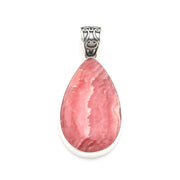 A teardrop-shaped pink stone pendant in a polished silver bezel setting with an ornate silver bail, shown on a plain white background.