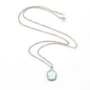 Silver necklace with a pendant on a white background