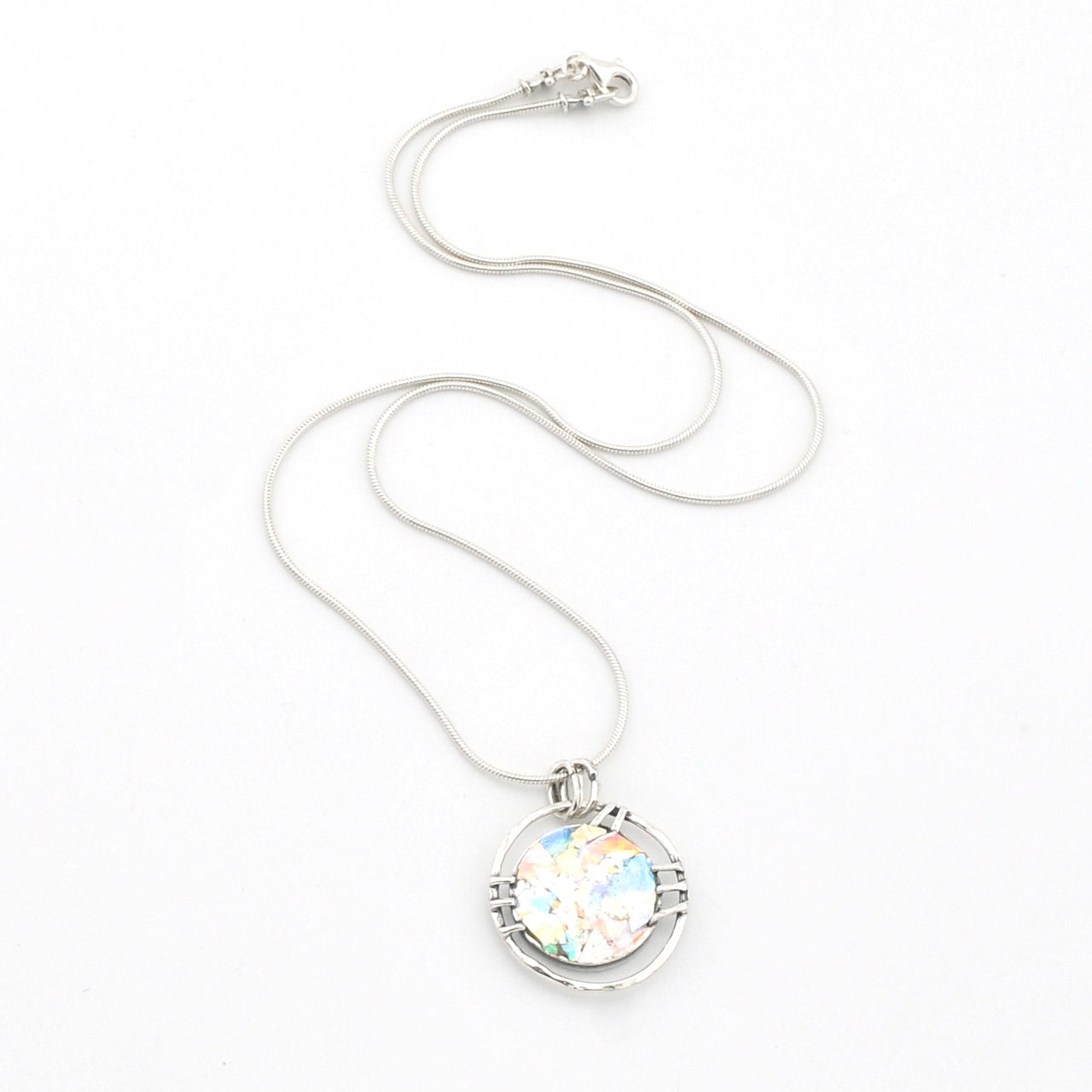 Silver necklace with a round ancient glass pendant on a white background